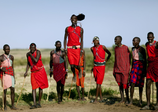 Maasai tribe men jumping during a ceremony, Rift Valley Province, Maasai Mara, Kenya