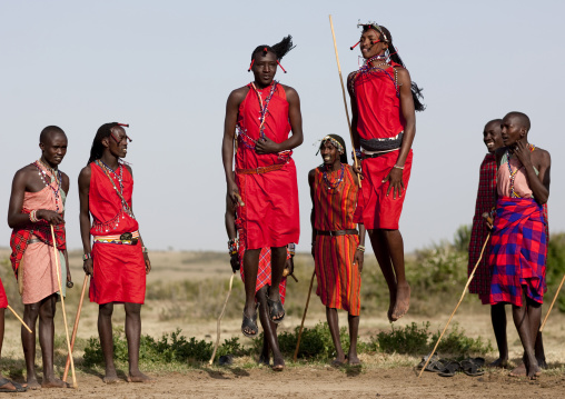 Maasai tribe men jumping during a ceremony, Rift Valley Province, Maasai Mara, Kenya