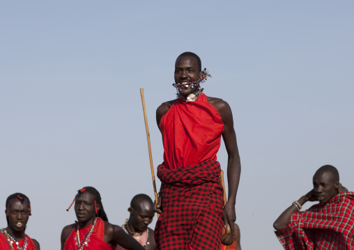 Maasai tribe men jumping during a ceremony, Rift Valley Province, Maasai Mara, Kenya