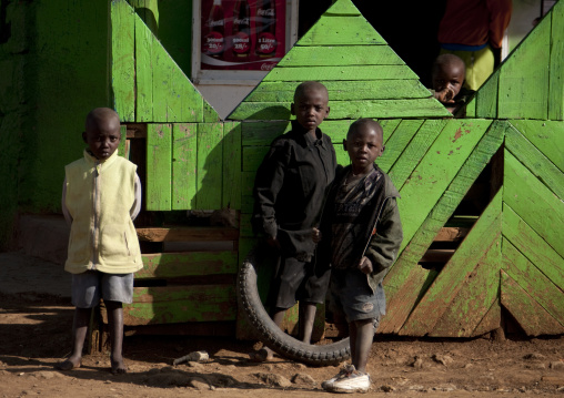 Kenyan children in front of green house, Rift Valley Province, Lake Nakuru, Kenya