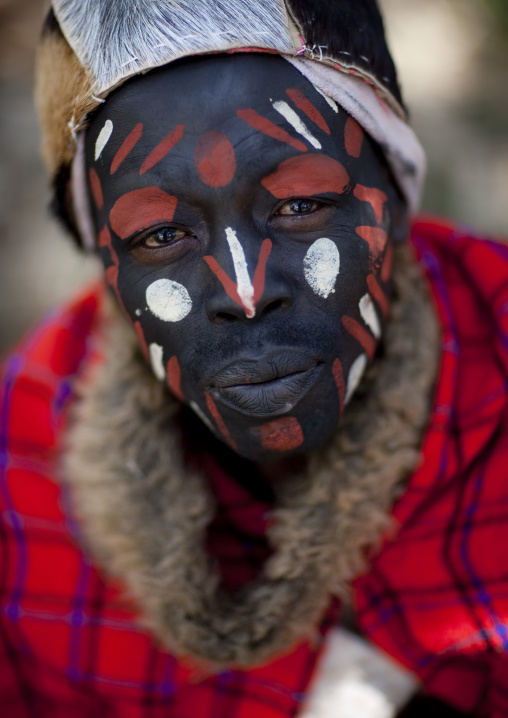 Portrait of a Kikuyu tribe warrior with traditional make up, Laikipia County, Thomson waterfalls, Kenya