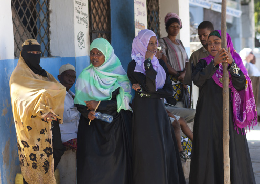 Small group of muslim women outside a house, Lamu County, Lamu, Kenya