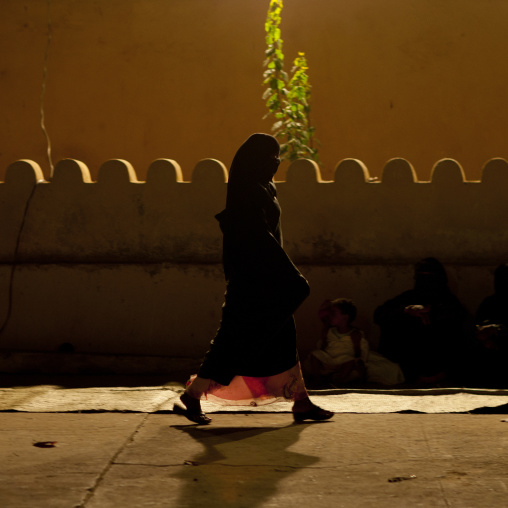 Muslim woman walking alone at night, Lamu County, Lamu, Kenya