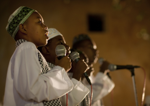 Muslim children singing on stage during Maulid festival, Lamu County, Lamu, Kenya
