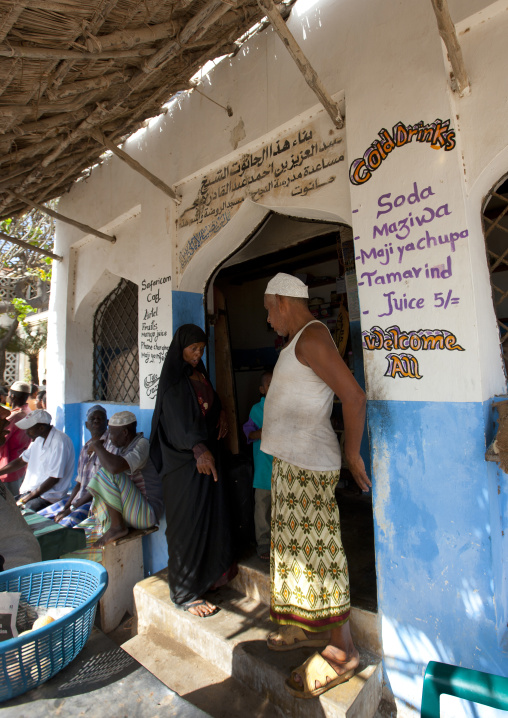 Muslim people at the entrance of a shop, Lamu County, Lamu, Kenya
