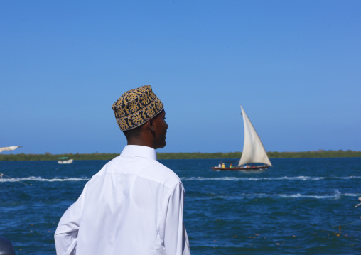 Man with kofia Looking towards the sea, Lamu County, Lamu, Kenya