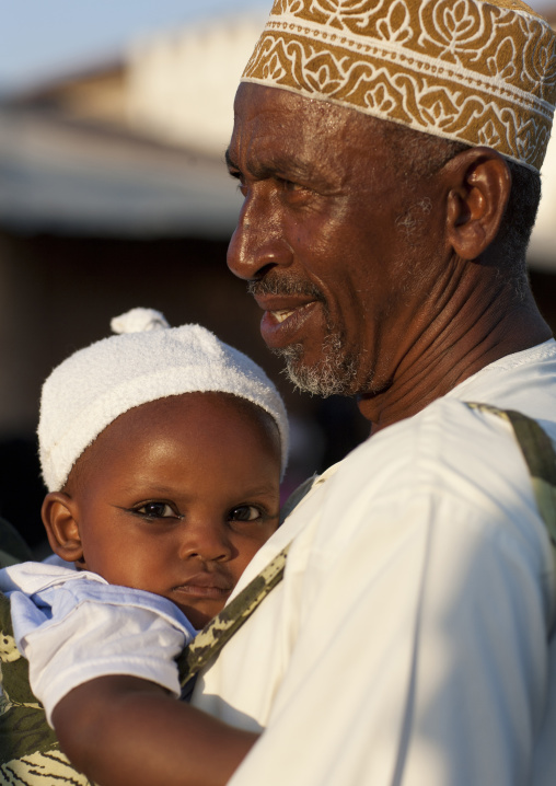 Muslim father with his baby, Lamu County, Lamu, Kenya