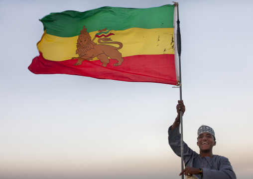 Teenage muslim boy holding an ethiopian flag, Lamu County, Lamu, Kenya
