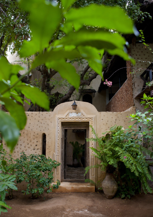 Carved wooden front door in fatuma towers hotel, Lamu County, Shela, Kenya