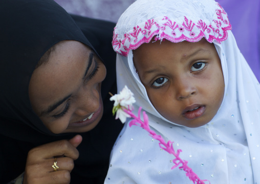 Muslim mother with her daughter during Maulid festival, Lamu County, Lamu, Kenya