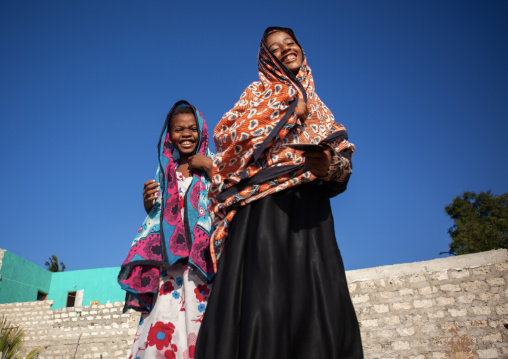 Smiling muslim teenage girls with colorful veils, Lamu County, Matondoni, Kenya