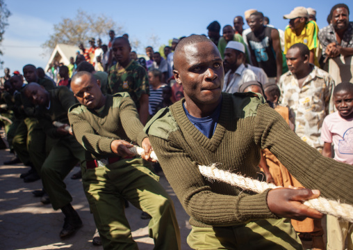 Policemen playing rope game during Maulid festival, Lamu County, Lamu, Kenya