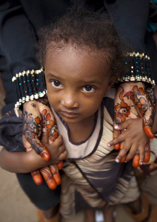 Muslim woman with henna painted hands and her daughter, Lamu County, Lamu, Kenya
