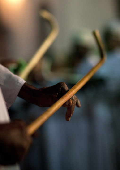 Muslim men singing and dancing with goma sticks during Maulid festival, Lamu County, Lamu, Kenya