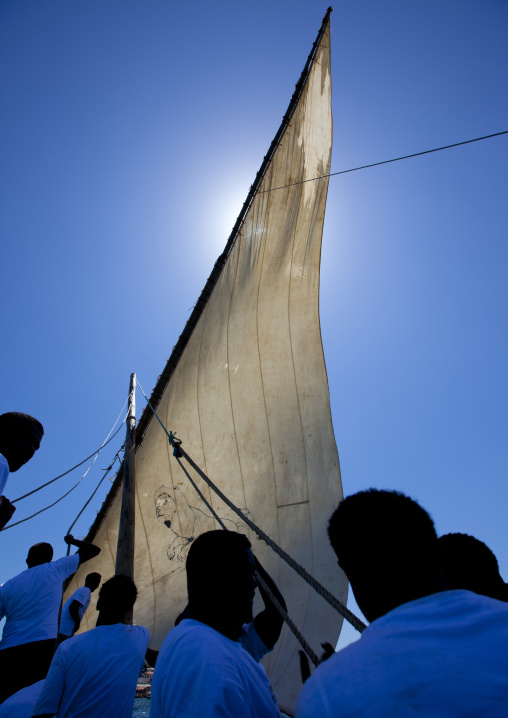 Men steering their dhow during the Maulid festival race, Lamu County, Lamu, Kenya
