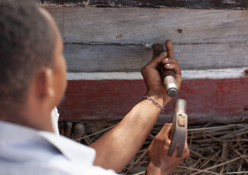 A shipbuilder working on a dhow, Lamu County, Matondoni, Kenya