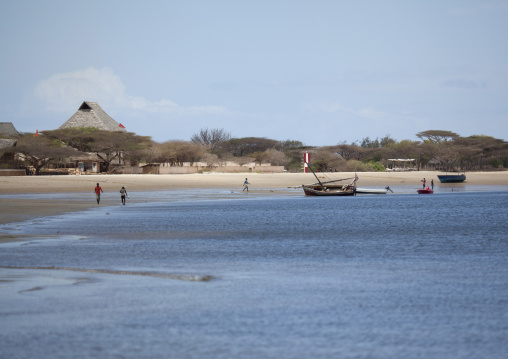 People walking on the beach in front Majlis hotel, Lamu County, Manda island, Kenya
