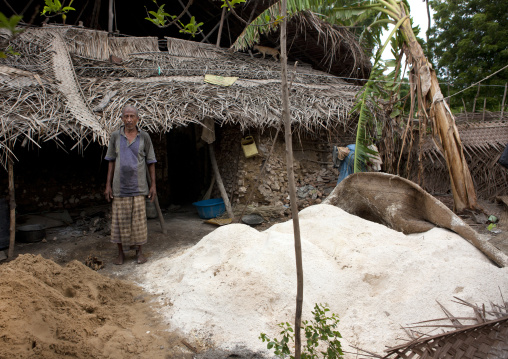 Kenyan man building a house, Lamu County, Pate Island, Kenya