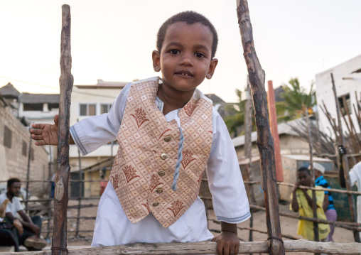 Sunni muslim boy dressed for the maulidi festivities, Lamu county, Lamu town, Kenya