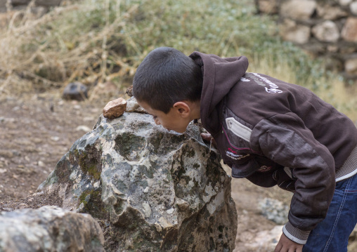 Yezedi Refugee From Sinjar Kissing A Sacred Stone In Lalesh Temple, Kurdistan, Iraq