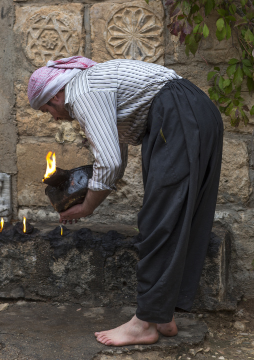 Yezedi Fakirs Lighting Sacred Fire In The Streets,  In Lalesh Temple, Kurdistan, Iraq
