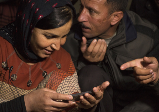 Yezedi Refugees From Sinjar Making A Conference On A Mobile Phone With Relatives, Zohar, Kurdistan, Iraq