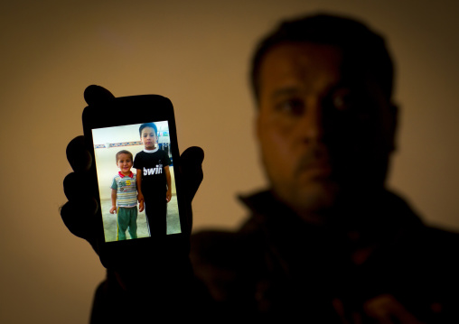 Yezedi Refugee From Sinjar Showing A Relative Killed By Daesh On His Mobile Phone, Zohar, Kurdistan, Iraq