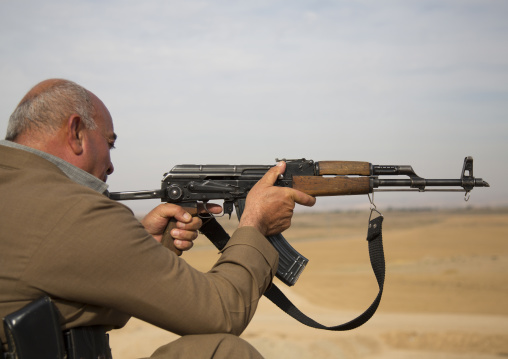 Kurdish Peshmerga Veteran Shooting On The Frontline, Kirkuk, Kurdistan, Iraq