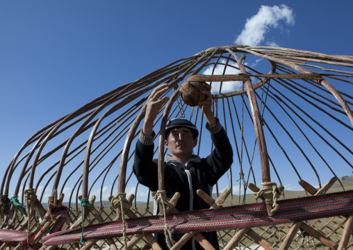 Man Putting Up A Yurt, Song Kol Lake Area, Kyrgyzstan