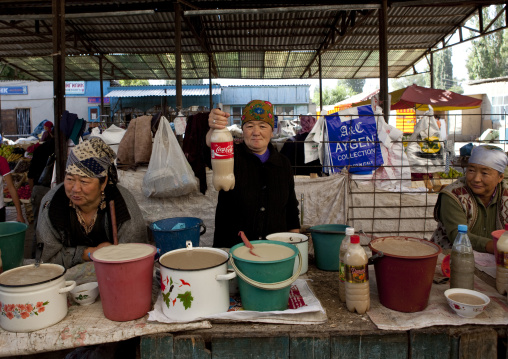 Women Selling Local Alcohol In Kochkor Market, Kyrgyzstan