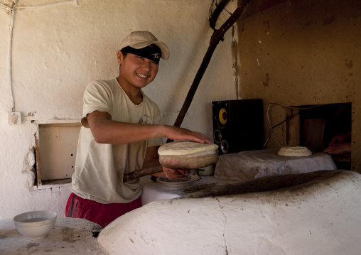 Boy With Cap Baking Bread, Kochkor Market, Kyrgyzstan
