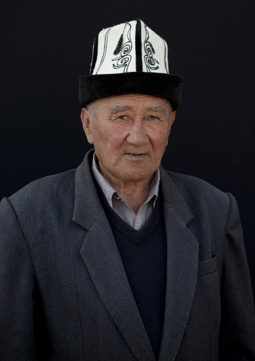 Old Man With A Kalpak Hat At The Animal Market In Kochkor, Kyrgyzstan