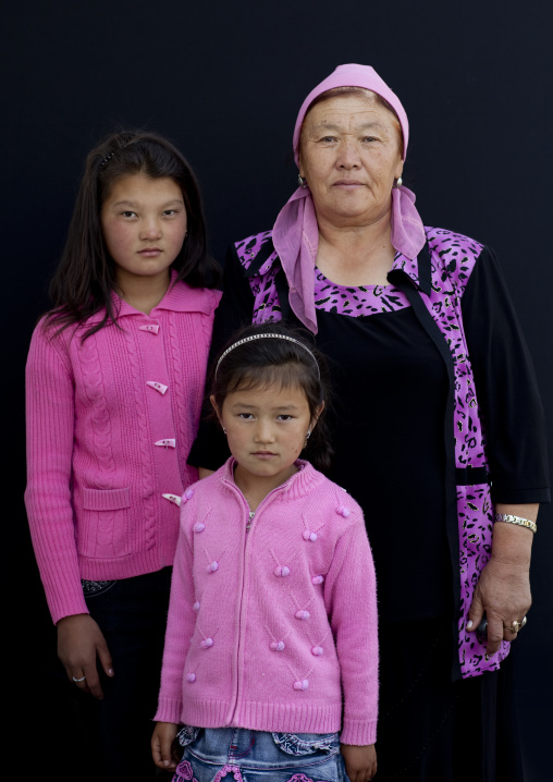 Woman With Headscarf And Girls At The Animal Market Of Kochkor, Kyrgyzstan