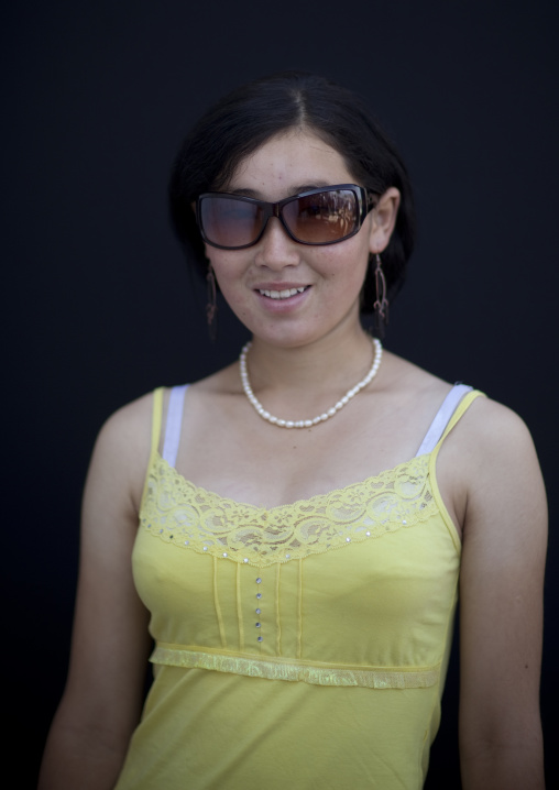 Woman Dressed In A Western Way In The Animal Market Of Kochkor, Kyrgyzstan