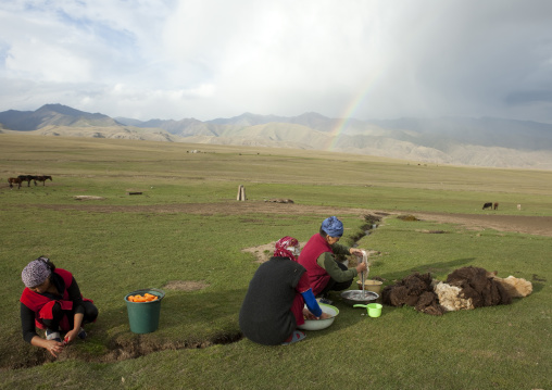 Women Washing Food With The Water Of A Brook, Saralasaz Jailoo, Song Kol Lake Area, Kyrgyzstan