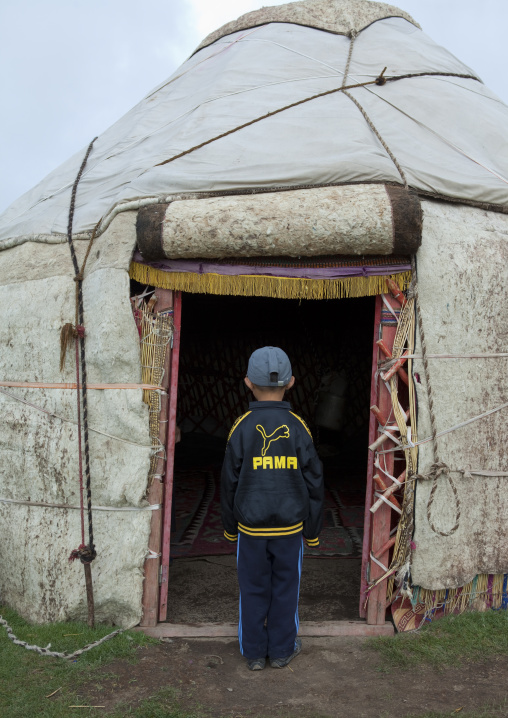 Boy In Front Of The Entrance Of His Yurt, Saralasaz Jailoo, Kyrgyzstan
