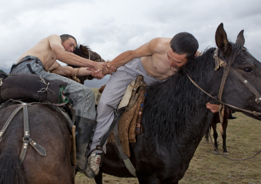 Men Doing Horse Wrestling In Saralasaz Jailoo, Kyrgyzstan