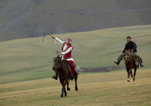 Man And Woman Playing Kyz Kuumai Horse Game, Saralasaz Jailoo, Kyrgyzstan
