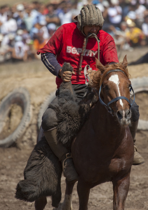 Horseman Carrying A Goat Carcass For A Horse Game On National Day, Bishkek, Kyrgyzstan