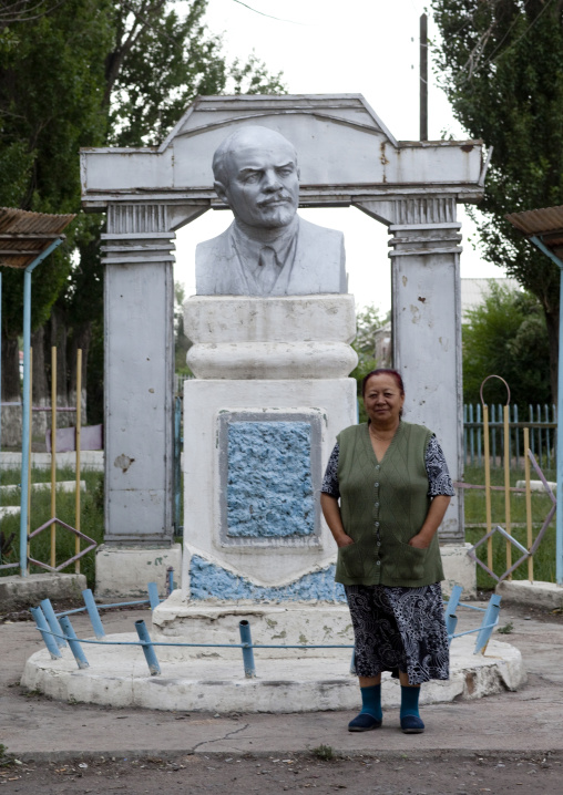 Woman In Front Of A Statue Of Lenin, Kochkor, Kyrgyzstan