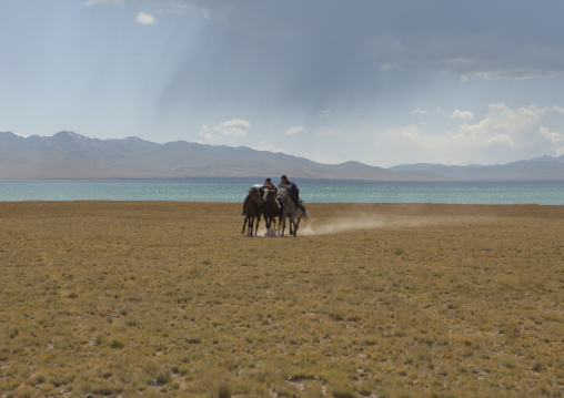 Men Playing A Horse Game In Front Of Song Kol Lake, Kyrgyzstan