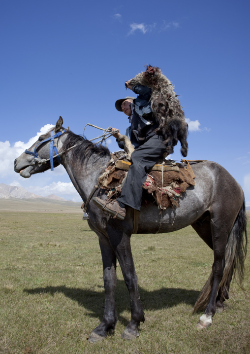 Man Holding The Sheep Skin Used For A Horse Game, Song Kol Lake Area, Kyrgyzstan