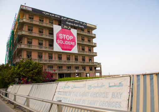 A sign at the abandonned saint george hotel protesting against the reconstruction project and the Solidere company running it, Beirut Governorate, Beirut, Lebanon