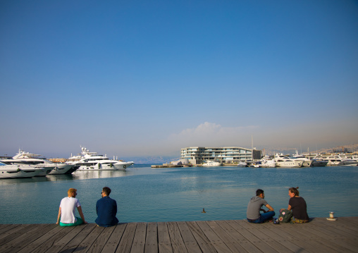 Couples sit in front in marina yacht club, Beirut Governorate, Beirut, Lebanon
