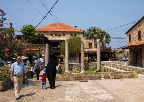 Tourists in  front of antique coloumns in the historic town, Mount Lebanon Governorate, Byblos, Lebanon