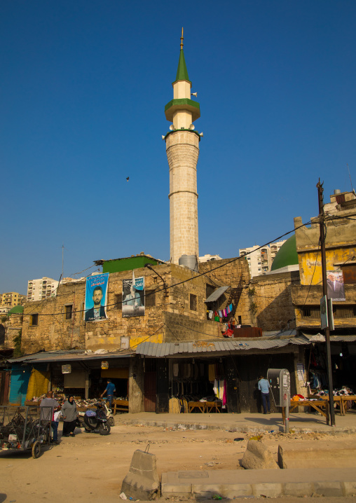 Mosque minaret in the middle of residential apartments and housing, North Governorate, Tripoli, Lebanon