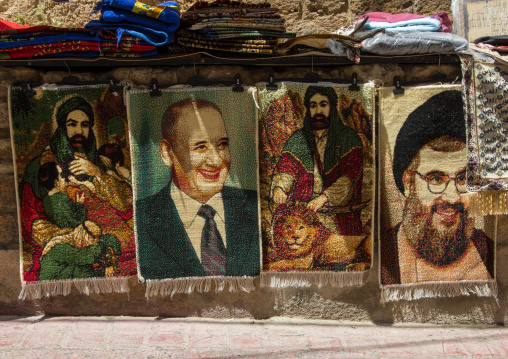 Sheikh Hassan Nasrallah and ali carpets for sale in the street, South Governorate, Tyre, Lebanon