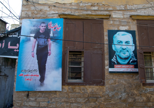 Hezbollah martyrs pictures on a wall, South Governorate, Tyre, Lebanon