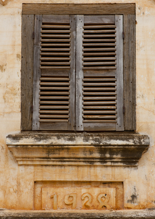 Window of an old french colonial building, Pakse, Laos