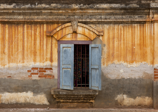 Window of an old french colonial building, Pakse, Laos